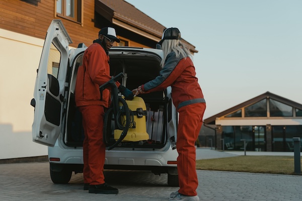 Maintenance Crew Removing Equipment from Their Van